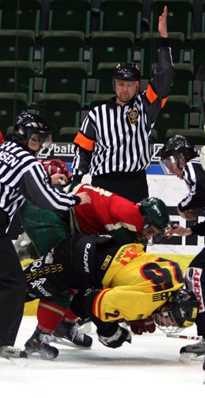 A fight during junior ice hockey game between ...