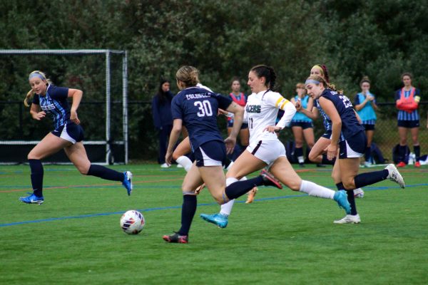 Pacers captain Josephine Sorce (11) cuts through the Colonels defense.